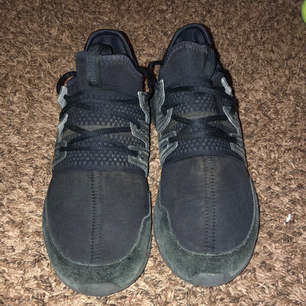 All black Adidas Tubular Radial PK shoes